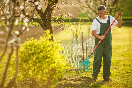 Seasonal maintenance activities in an Archway landscape garden